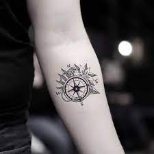 Thing interesting compass tattoo features a cutaway design showing parts of a globe and a mountain scene at the stop. Amazon Com Compass Rose Temporary Fake Tattoo Sticker Set Of 2 Www Ohmytat Com Beauty Personal Care