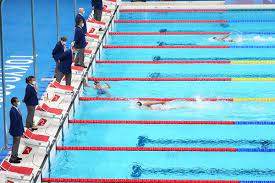 Olympic swimming trials with her usual swim gear and unparalleled goals — plus a carefully folded black cap and gown. Qznci3wr9ugfam