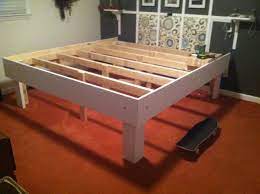 Make a king size bed (with storage) wrapped in barn wood! Diy Easy King Size Platform Bed With 17 Of Storage Space Underneath Diy Bed Frame Plans Diy Platform Bed Diy King Bed Frame
