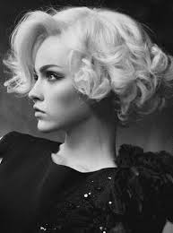 Vintage style Curly Bob. I wonder how long her hair actually is?