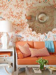 Living room burnt orange wallpaper. White Greek Key Sofa With Orange Cushions Hollywood Regency Living Room