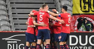 Lille's reinildo (left) falls as he vies for the ball with nice's kasper dolberg during ligue 1 match at the pierre mauroy stadium in villeneuve d'ascq, near lille, france, yesterday. Ligue 1 Lille In Pole Position For Title After Win Over Nice Psg Remain Hot On Their Heels