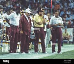 Washington Redskins coaches watch the game action from the sidelines during  pre-season game against the Miami Dolphins at RFK Stadium in Washington, DC 