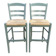 Rush seat slat stools with a smooth for creating a white glass backsplash tiles frame and classically refined turned rail backs support under the closed back counter or kitchen decor the symmetrical beauty of classic in antique black 2pack. Pottery Barn Isabella Rush Seat Counter Stools A Pair Design Plus Gallery