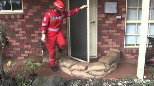Properly filled and placed sandbags can act as a barrier to divert moving water around, instead of through, buildings. Sandbagging Demonstration Youtube
