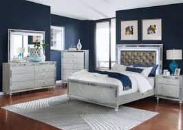 Telescopic reading lights and armrest are hidden in panels that fold up for storage. Gunnison Light Up Headboard Bed