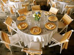 White And Gold Wedding White Satin Linen Gold Charger Plates And Gold Satin Sashes On White Re Wedding Reception Chairs Indoor Wedding Receptions Fancy Table