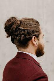 Man Bun With A Twist A Braid In Fact We Love This Updo For The Groom For An Alternative Bun Jovana Combs Beaut Braided Man Bun Long Hair Styles Men