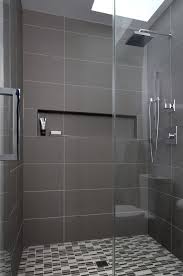 Looking for small bathroom ideas? Simple And Elegant Bathroom With Black Tapware Large Format Grey Tiles An Bathroom Design Small Modern Bathroom Remodel Designs Small Bathroom Remodel Designs