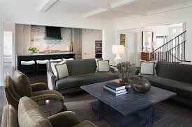 An aerin charlton chandelier hangs over a burl wood parson's coffee table flanked by facing olive green velvet accent chairs and placed in. Olive Green Velvet Living Room Chairs Design Ideas