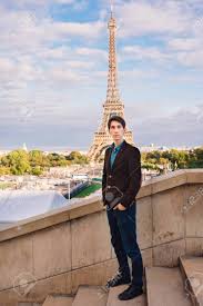 A Man Against The Backdrop Of The Eiffel Tower In Paris, France. A  Conceptual Journey. Stock Photo, Picture and Royalty Free Image. Image  144783759.