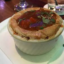 Couscous, a small type of pasta, is made from crushed and steamed durum wheat. Filet On A Deep Fried Bun Covered With White Wine Mushroom Sauce Pap And Gravy Couscous Side Picture Of Peli Peli Houston Tripadvisor