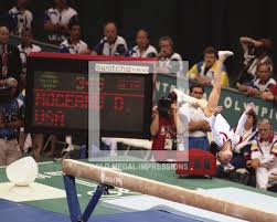 Dominique moceanu was the youngest member of the celebrated magnificent 7 gymnasts who won the team gold at the 1996 olympic games. Dominique Moceanu Usa Gymnast On The Balance Beam Gold Medal Impressions