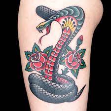 What do the snake tattoos mean? Pin On American Traditional Snake Tattoos