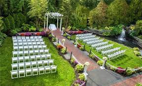 Green Outdoor Garden Wedding Ceremony With White Chairs The Fox Hollow On Long Island N Outdoor Wedding Venues Long Island Wedding Garden Weddings Ceremony