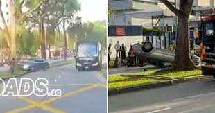 The singapore civil defence force (scdf) said the driver of the car and his passenger were taken to sengkang general hospital. Car Crashes Into Tree Flips Over After Swerving At Last Moment To Avoid Hitting Parked Bus Mothership Sg News From Singapore Asia And Around The World
