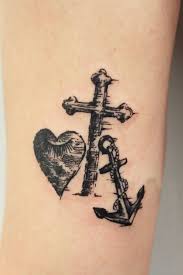 Black matching heart tattoos on both ankles. Heart Cross Anchor Tattoo Entertainmentmesh