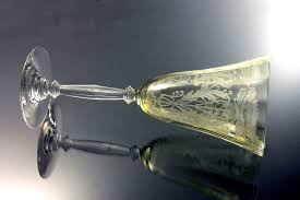The pattern came about as a result of economic accident. Crystal Etched Wine Glass Depression Glass Yellow Clear Stem Floral Pattern