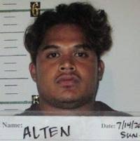 Man arrested, charged in machete incident