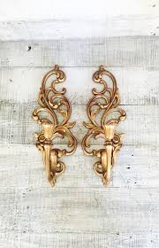 5 out of 5 stars (81) $ 56.50. Wall Sconces Pair Of Hollywood Regency Gold Candle Sconces Ornate Gold Candle Holder Vintage Syroco Plasti Gold Candle Sconces Wall Sconces Gold Candle Holders