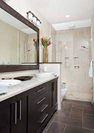 The large dark navy tiles in the shower really complement the lighter blue tone of the wall paint, and the lighter floor tile pattern really. 35 Ideas Kitchen Dark Cabinets Espresso Master Bath Eclectic Bathroom Brown Tile Bathroom Bathroom Remodel Master