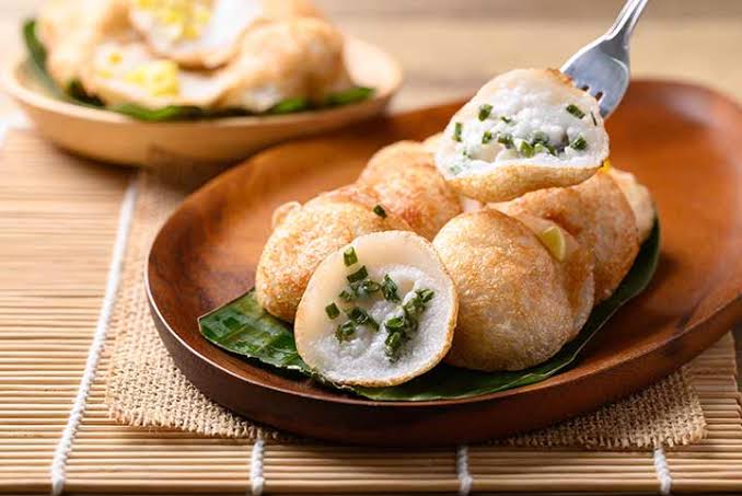Khanom Krok street snacks enjoyed during floating lantern festivities.