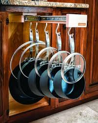 You can slide the lids into the rails for even smarter storage. 11 Genius Ways To Organize Pots Pans Organization Obsessed