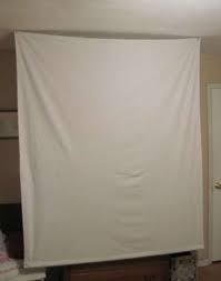 In order to make the frame, you will need 5 pieces of wood, metal connectors, screws, and an electric drill. Make A Portable Projector Screen For Less Than Ten Bucks Projector Screen Diy Diy Projection Screen Outdoor Movie Screen