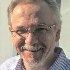 Curved entryway paneling with vaulted elliptical pass-through.