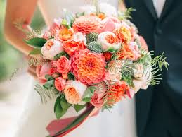 (above) a wild, romantic cascading spring bridal bouquet of white and blush peonies, sprinkled with white anemones and tulips. Wedding Flower Guide With Season Color And Price Details