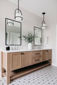 There are four drawers, two cabinets, and room for two sinks on the top. White Oak Vanity