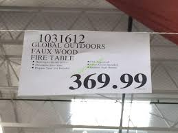 Reflective fire glass adds warmth and illumination. Global Outdoors Faux Wood Fire Table Costcochaser