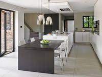 It has a solid wooden frame with a white finish, and a top with a natural finish. 50 Kitchen Island With Table Attached Ideas Kitchen Design Modern Kitchen Kitchen Remodel