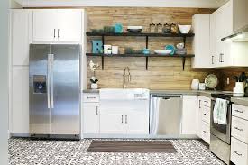 The porcelain faux wood flooring and the area rug adds texture and splash of color to the room. Basement Kitchen Reveal Bower Power
