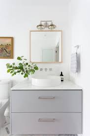round vessel sink with gray dresser