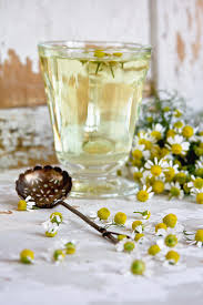 Glass cup with chamomile tea, tea strainer, chamomile flowers on a wooden background. Camomille Tea Photograph By C Tasty Food And Photography