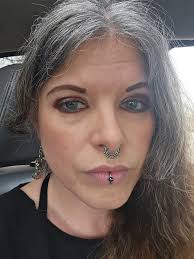 I will always be wearing giant earrings and lots of jewelry. But I have a  constant push/pull between nude lips and red. But now I'm bringing black  back into the mix and