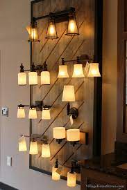 Creative Wall Mount Lighting Display In Village Home Stores Showroom Villagehomestores Com Lighting Showroom Lighting Showroom Design