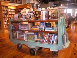 An Old Industrial Cart Used As A Focal Point Display Cafe Display Bookstore Design Bookshelves Diy