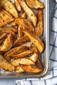 Seasoned Roasted Potato Wedges Simply Whisked Tip the potatoes onto a baking tray.