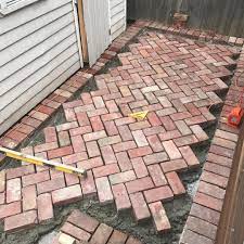 The fabric's name comes from its resemblance to the bones of a herring fish. Making Progress On Our Current Project With Some Old Red Brick Paving In 45 Degree Herringbone Redbrick Paving 4 Brick Patios Brick Paver Patio Brick Paving