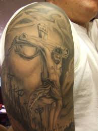 This tattoo includes a black inked skull face that fits on your arm and black outlined roses with red ink inside. Half Sleeve Tattoos For Men Religious Elegant Arts Tattoo