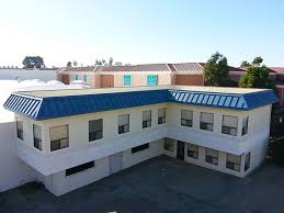 Regan roofing, inc provides quality roof repair and roof replacement services in oceanside, san diego, carlsbad and the nearby areas. Carlsbad Commercial Roof In Blue Metal Commercial Roofing Roofing Roof Repair