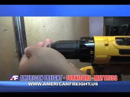 Flat bracket plates are screwed into the mirror frame at one end and into the back of the dresser at the other end. American Freight How To S How To Attach A Mirror To A Dresser Youtube