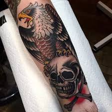 Grez works out of the manhattan studio located on bowery and spring. Eagle Skull Ear Tattoo