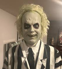 Beetlejuice possessing girl scout costumes