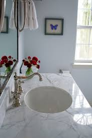 Carrara marble adds elegance to bathrooms, and a pedestal sink provides a graceful way to include this luminous stone. White Carrera Marble Countertop Transitional Bathroom Benjamin Moore Seafoam Teresa Meyer Interiors