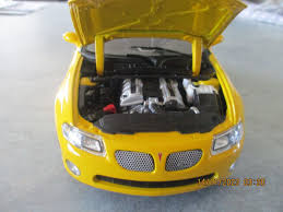 Image result for Yellow 2004 Pontiac