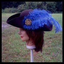 We also carry a handful of other feathers, including peacock tail feathers, which are well known for their color and unique design. Chocolate Colored Tricorn Pirate Hat With Blue Feather Plume Use The Coupon Code Blue Feather Chocolate Color Hats