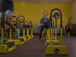 Woman Doing Step Ups In A Planet Fitness 30 Minute Circuit Area Planet Fitness Workout Circuit Workout Planet Fitness Workout Plan